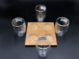A Set Of A 4 Section Bamboo Tray With 4 Doublewalled Thermo Glasses To Match